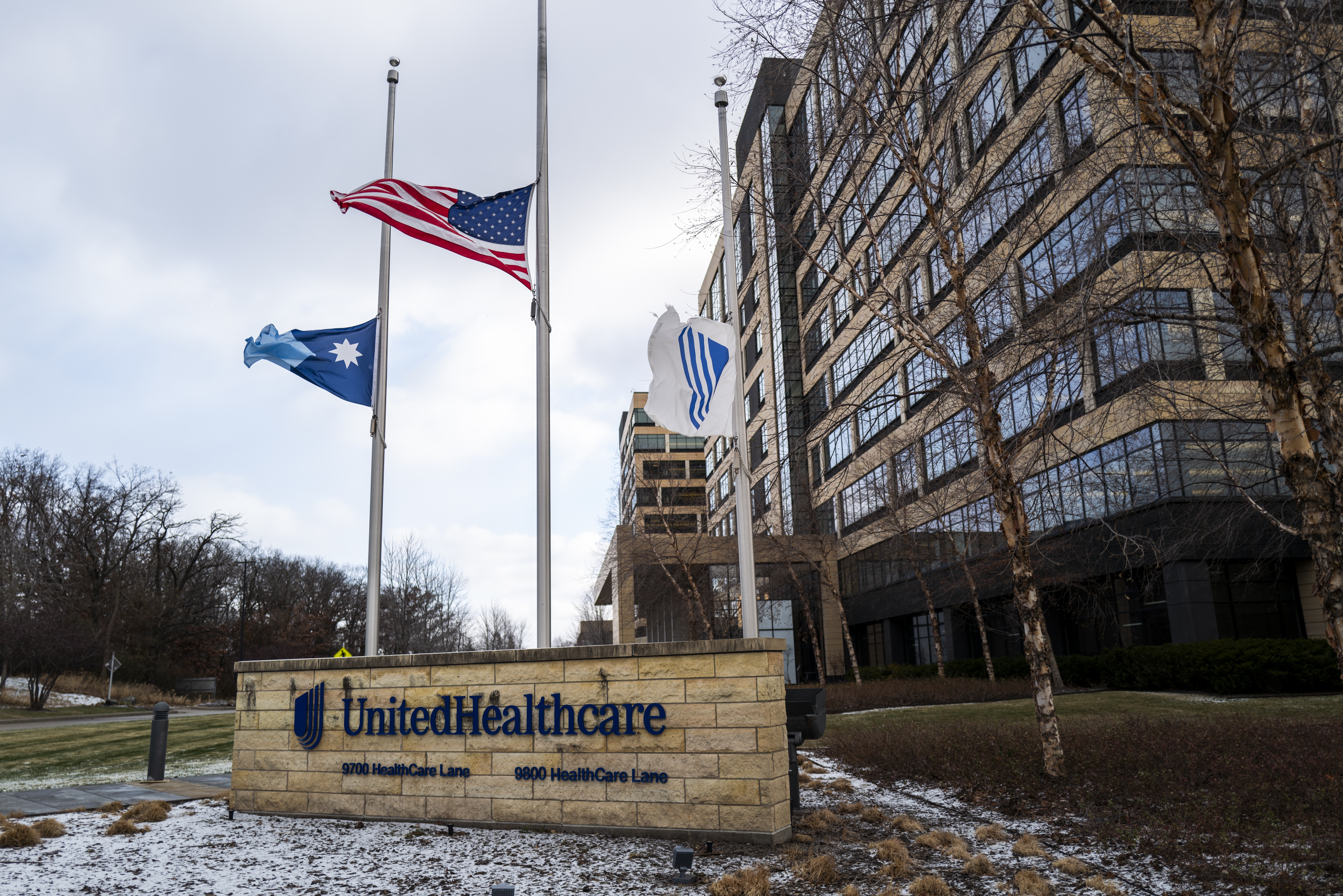 Flags fly at half-staff outside the UnitedHealthcare corporate headquarters in Minnetonka, Minn., on Dec. 4, 2024, after CEO Brian Thompson was shot dead on a street in New York City. The shocking act of violence sparked a widespread consumer outcry over U.S. health care costs and denied claims.